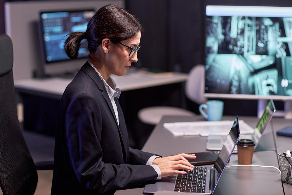 Cybersecurity professional working on computer