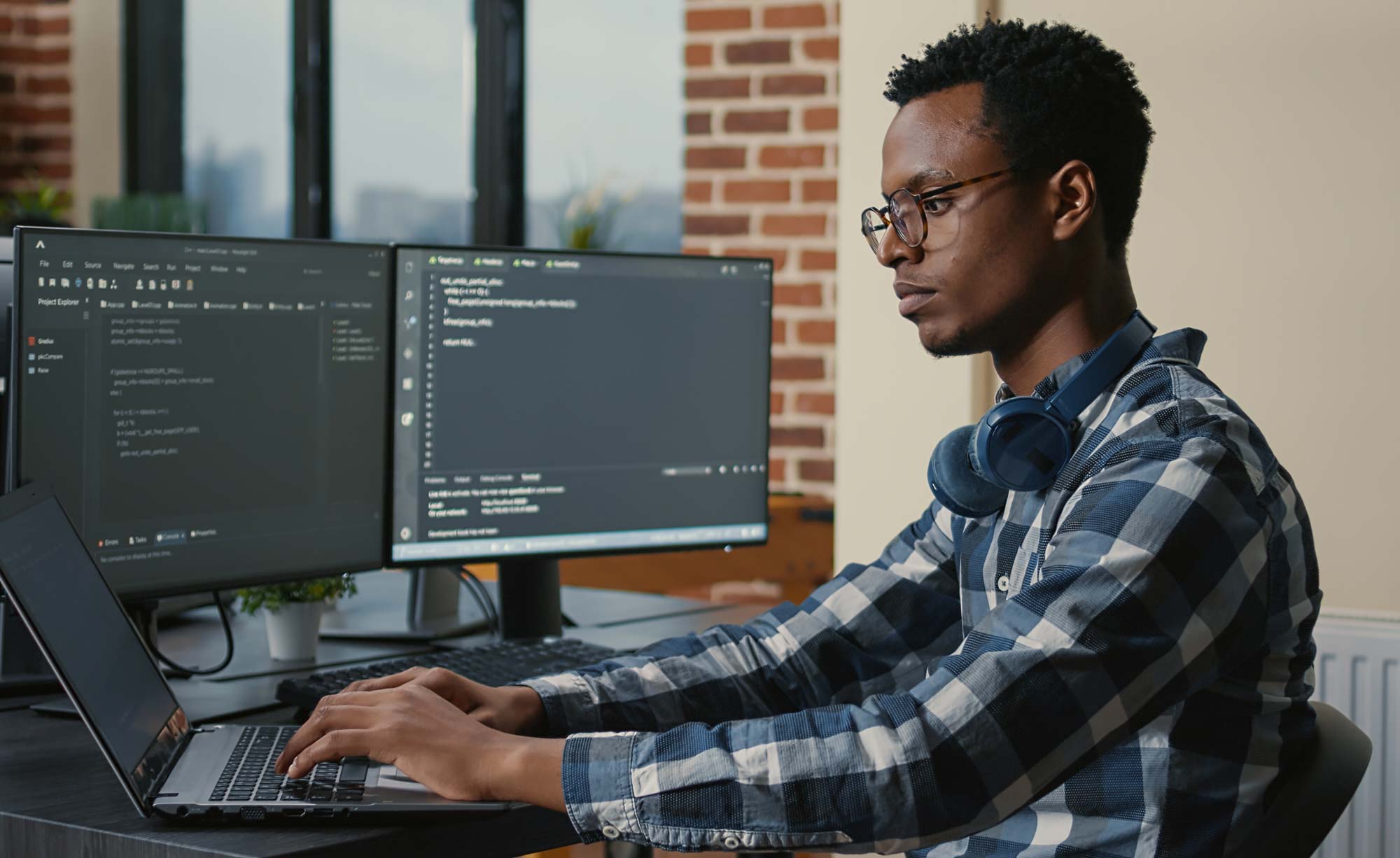 graduate student working in cybersecurity on computer 