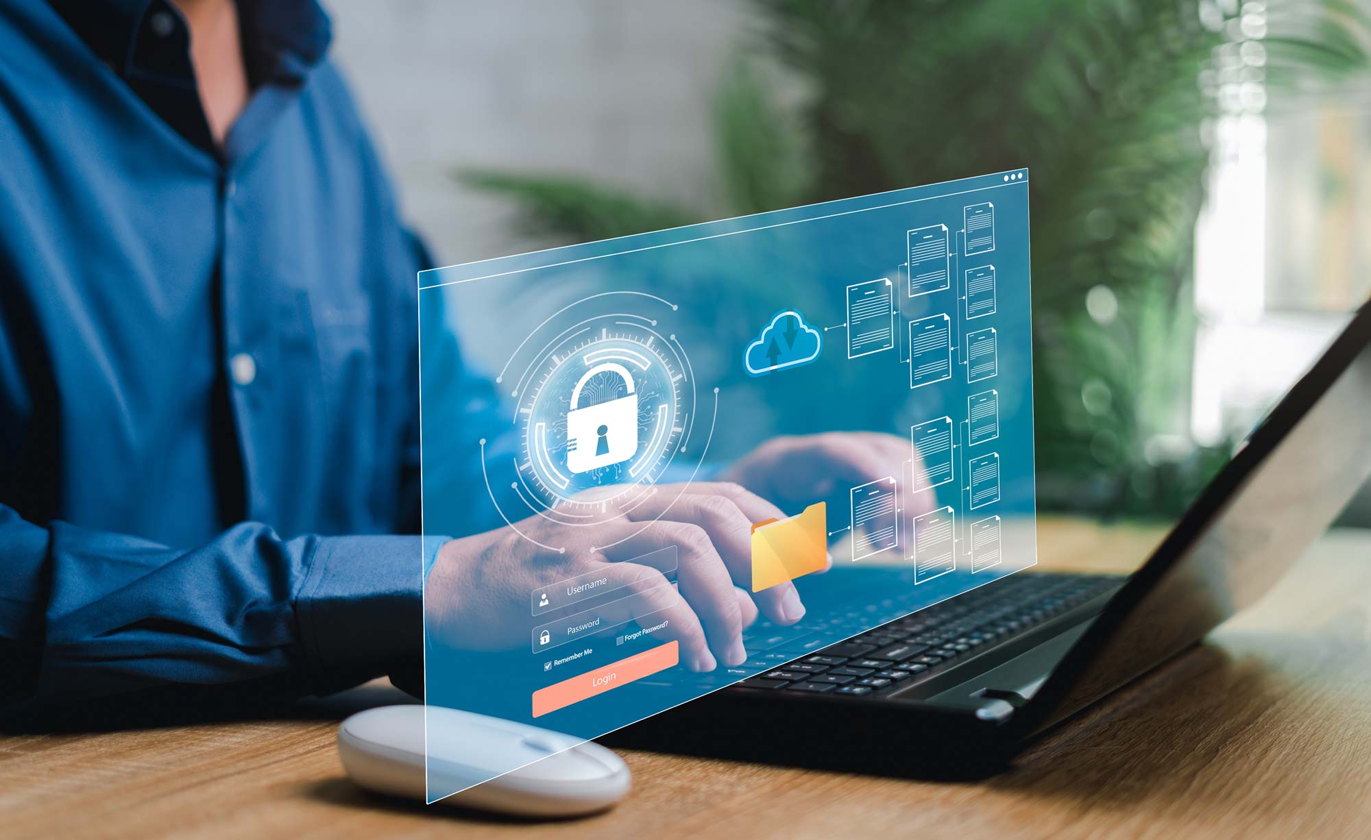 person on computer enabling cybersecurity