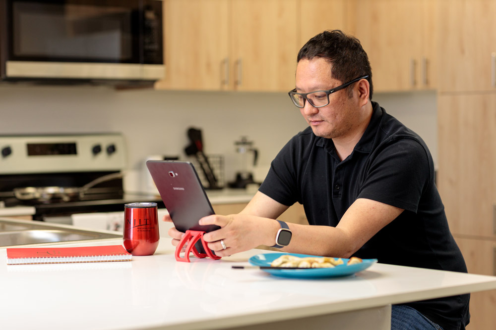 adult online learner working at home