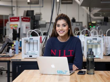 Photo of female student using a laptop